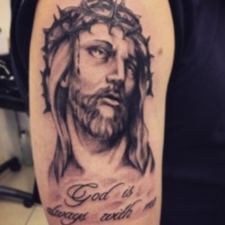 Иисус и надпись  на плече (на руке)