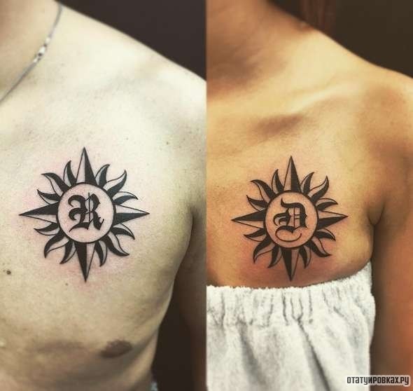 Фотография татуировки под названием «Солнце с буквой»