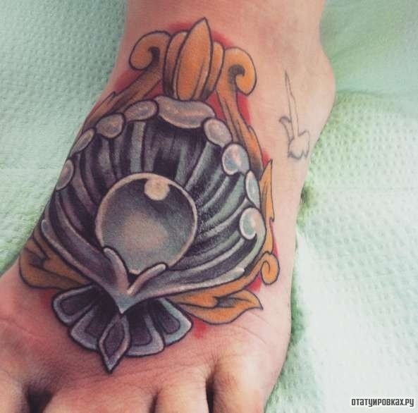 Фотография татуировки под названием «Жемчужина в ракушке»