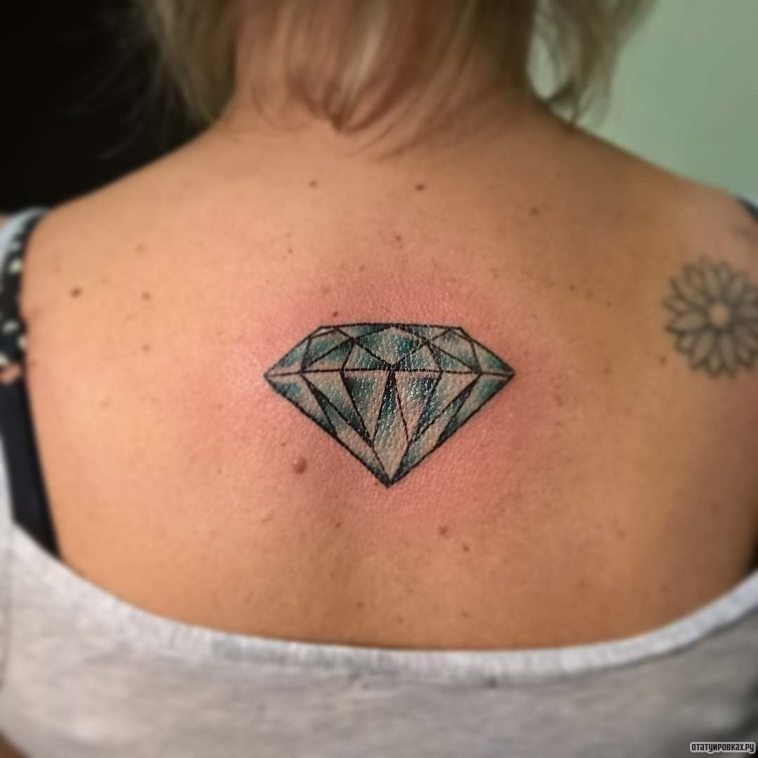 Фотография татуировки под названием «Голубой бриллиант»