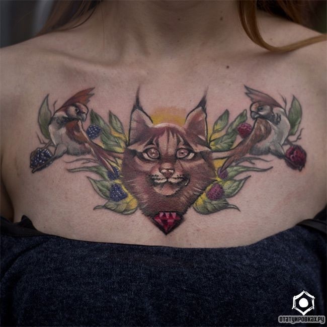 Фотография татуировки под названием «Рысь с птицами и ягодами»