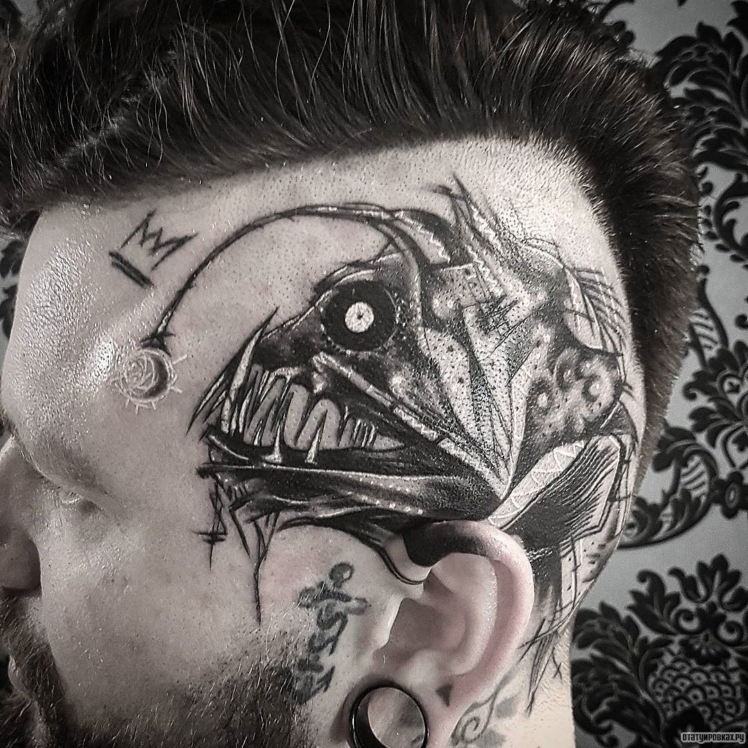 Фотография татуировки под названием «Непонятное чудовище в виде рыбы»