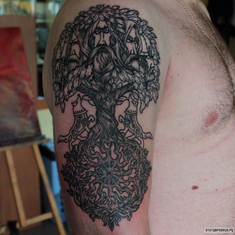 Фотография татуировки под названием «Дерево с собаками»