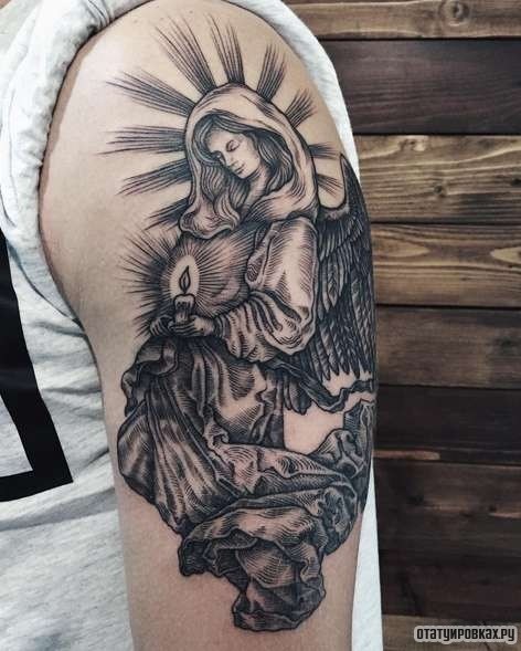 Фотография татуировки под названием «Ангел со свечой в руках»