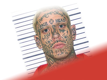 Заключенный с тату на лице