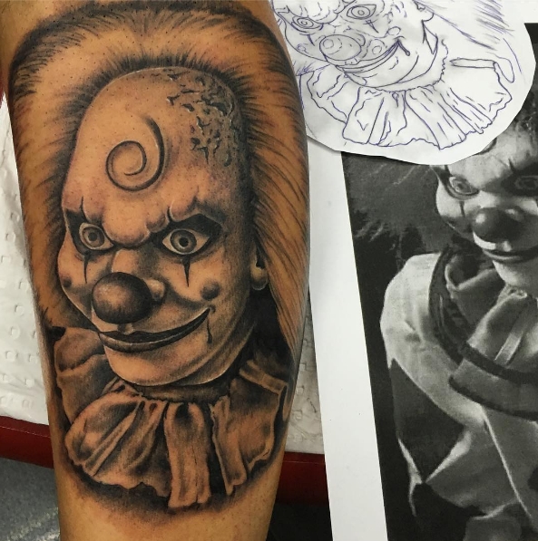 Злой клоун на татуировке