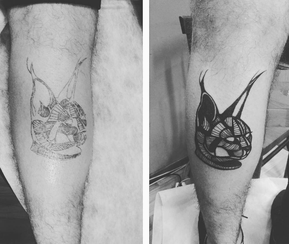Рысь в виде татуировки на ноге