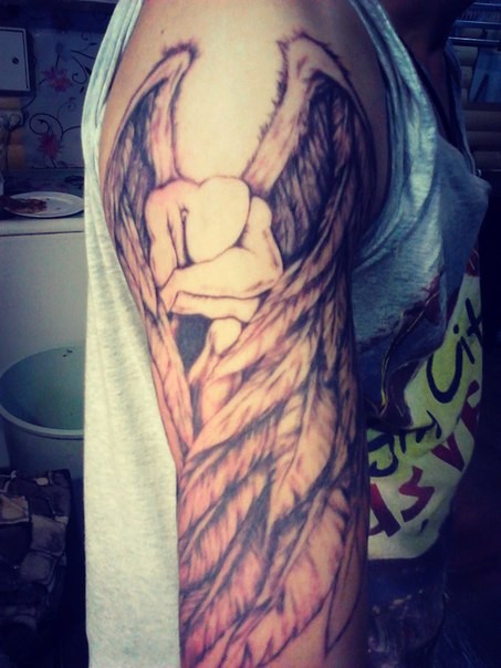 Фотография татуировки под названием «ангел»