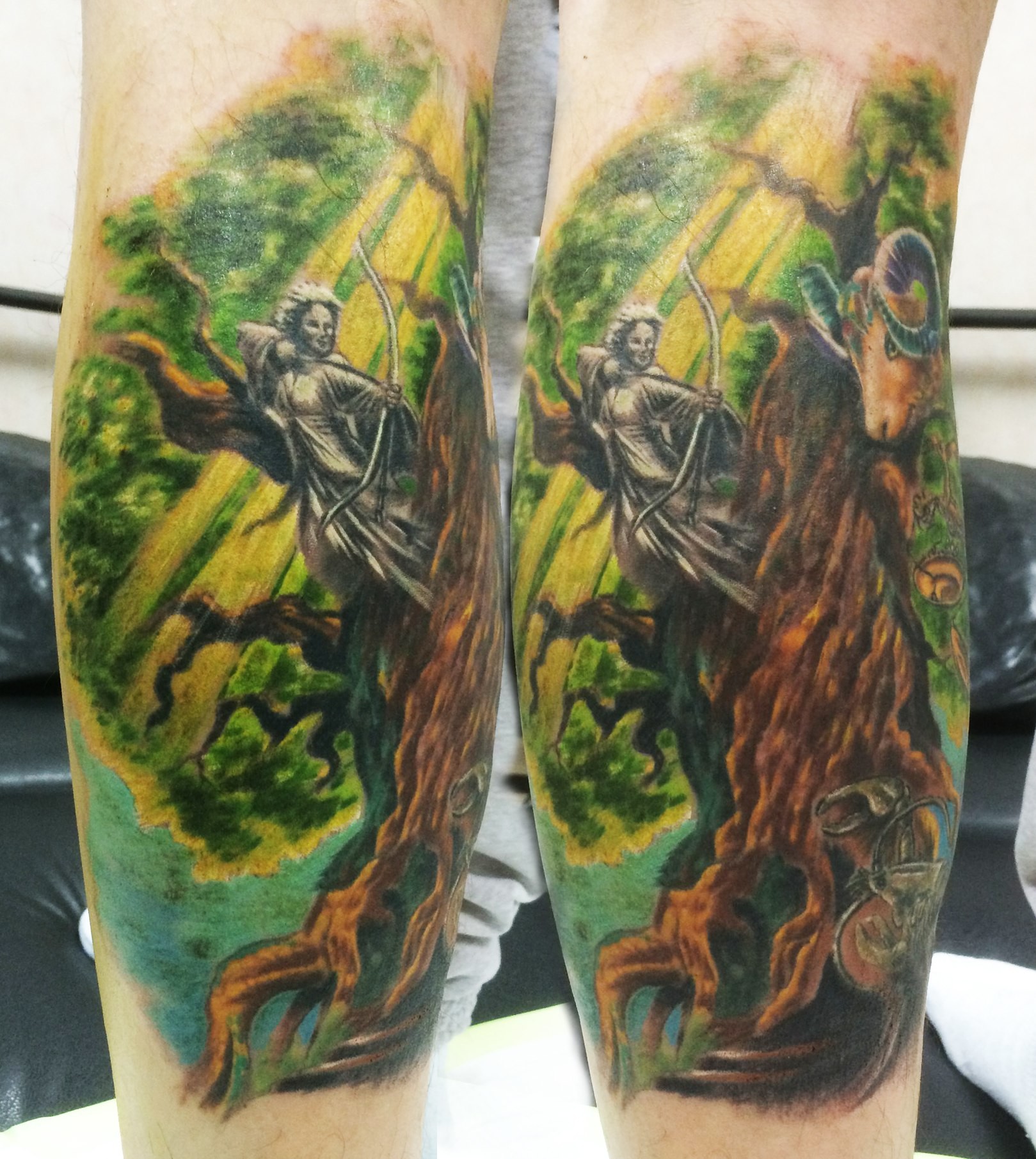 Фотография татуировки под названием «Человек с луком, дерево и баран»