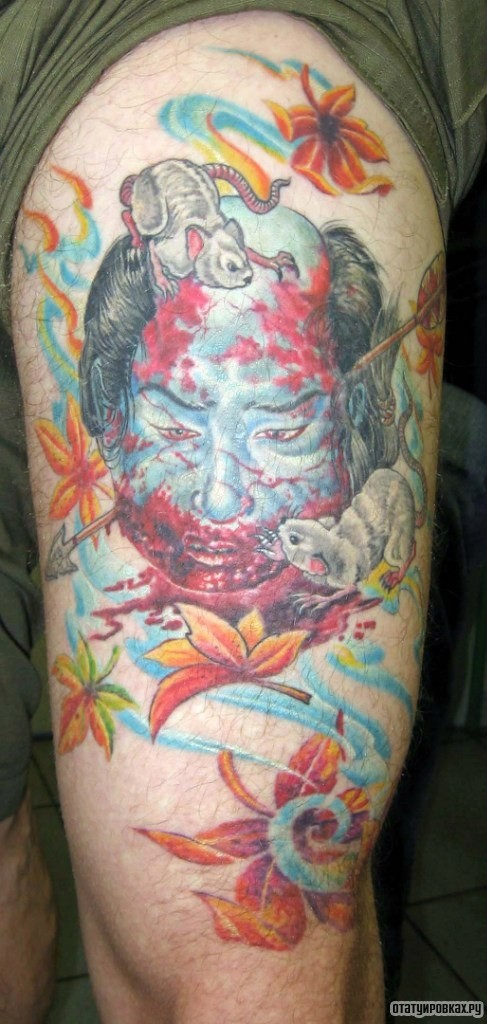 Фотография татуировки под названием «Лицо человека пронизанная стрелой»