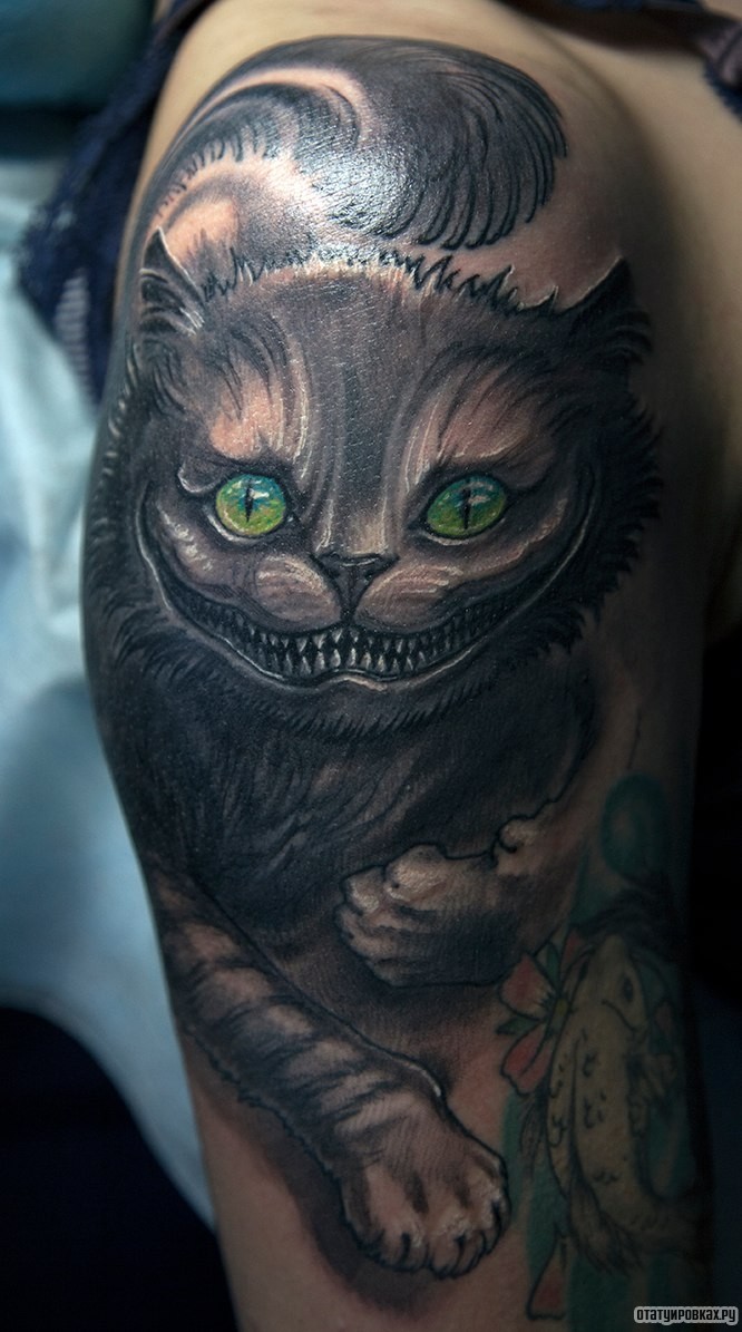 Фотография татуировки под названием «Чеширский кот»