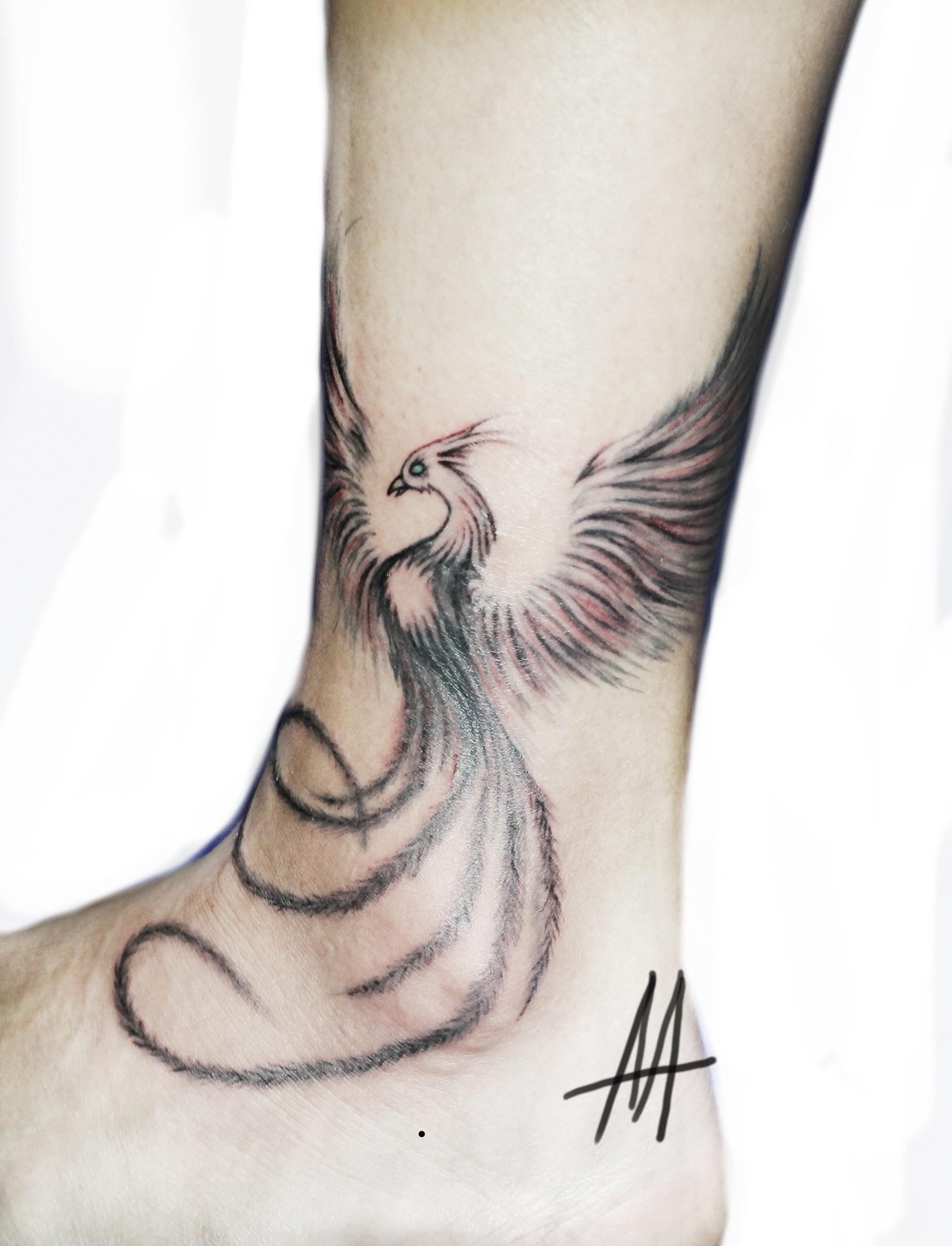 Фотография татуировки под названием «Феникс»