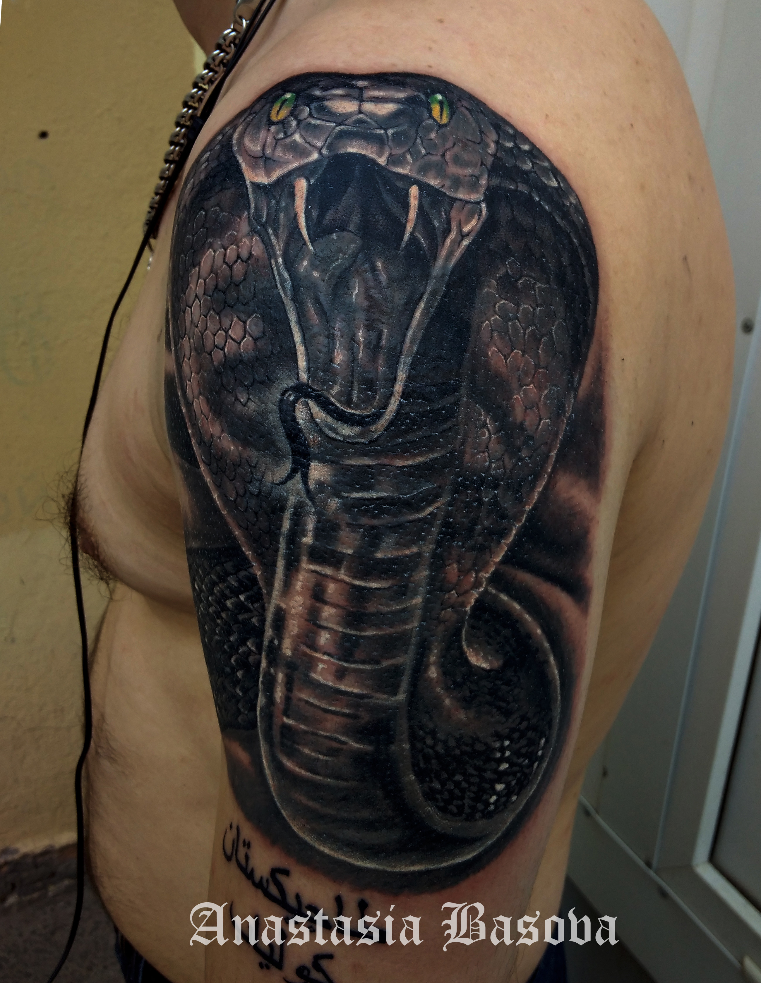 Фотография татуировки под названием «кобра»