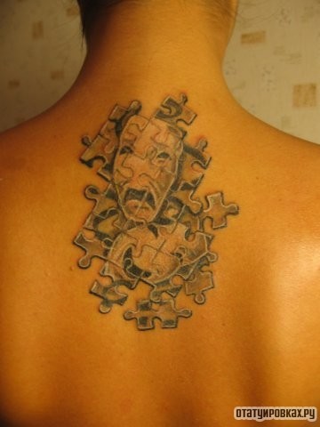 Фотография татуировки под названием «Пазлы с масками»