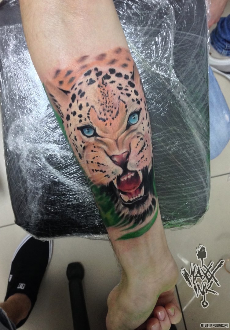 Фотография татуировки под названием «Ягуар оскал»