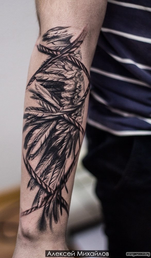 Фотография татуировки под названием «Перья крыла с веревкой»