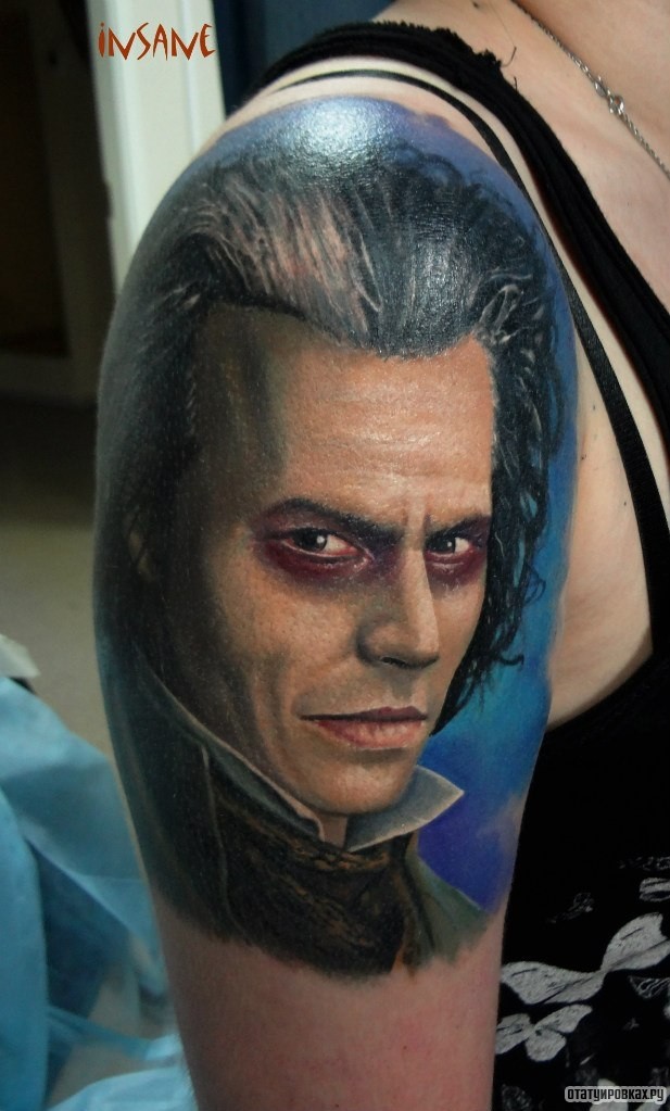 Фотография татуировки под названием «Человек с красными глазами»
