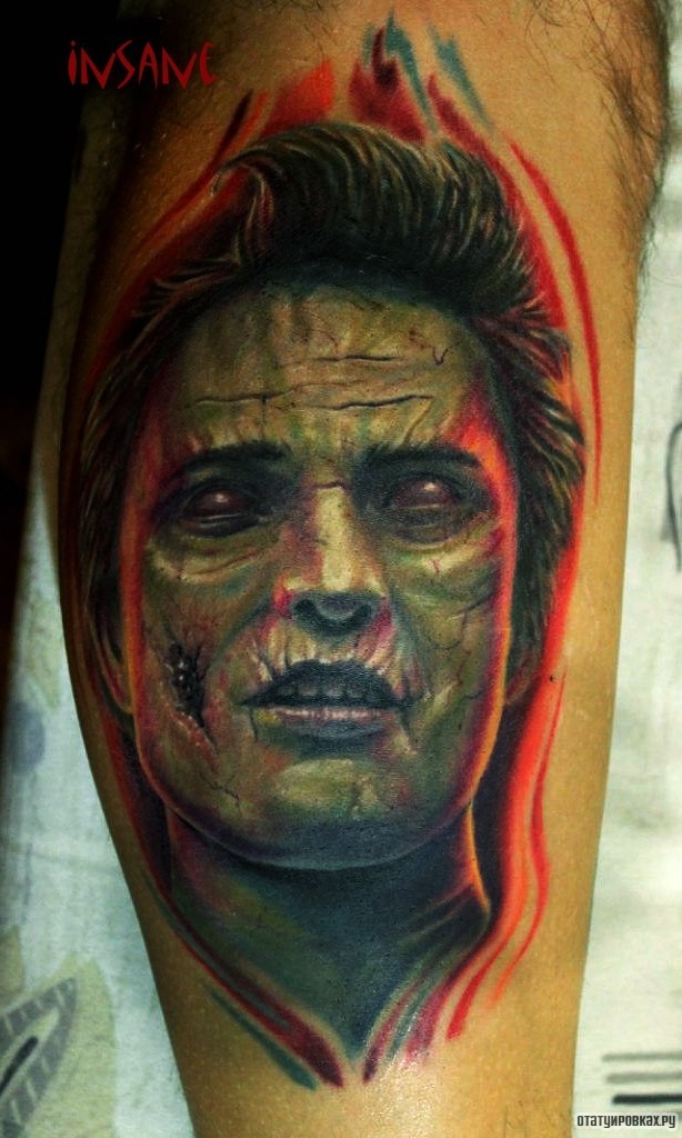 Фотография татуировки под названием «Зеленый человек»