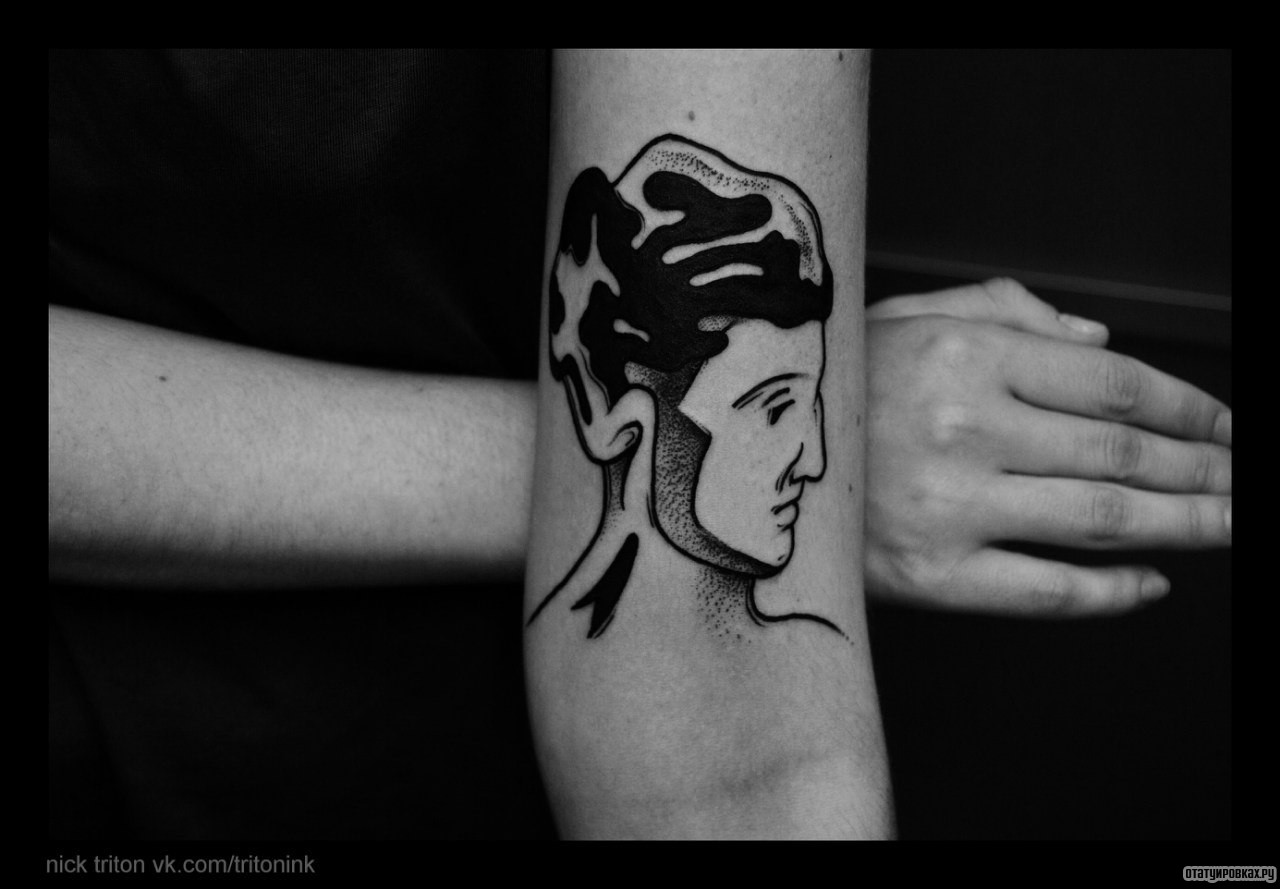 Фотография татуировки под названием «Голова человека»