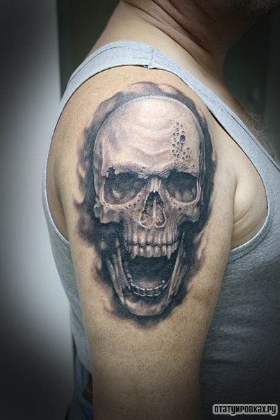 Фотография татуировки под названием «Череп с открытым ртом»