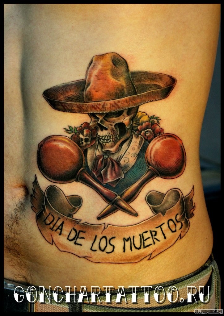Фотография татуировки под названием «Череп и музыкальные инструменты маракас»