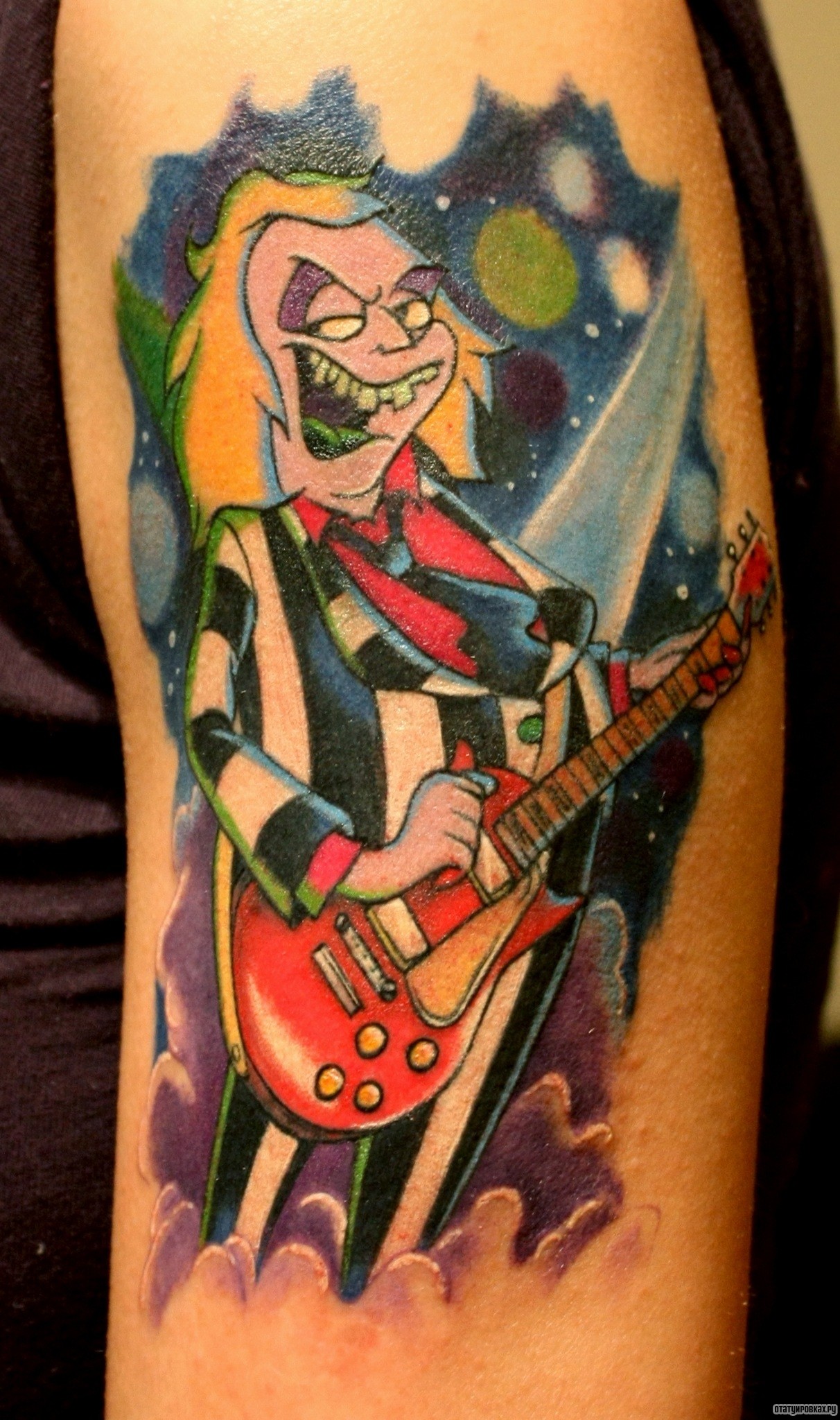 Фотография татуировки под названием «Гитарист»
