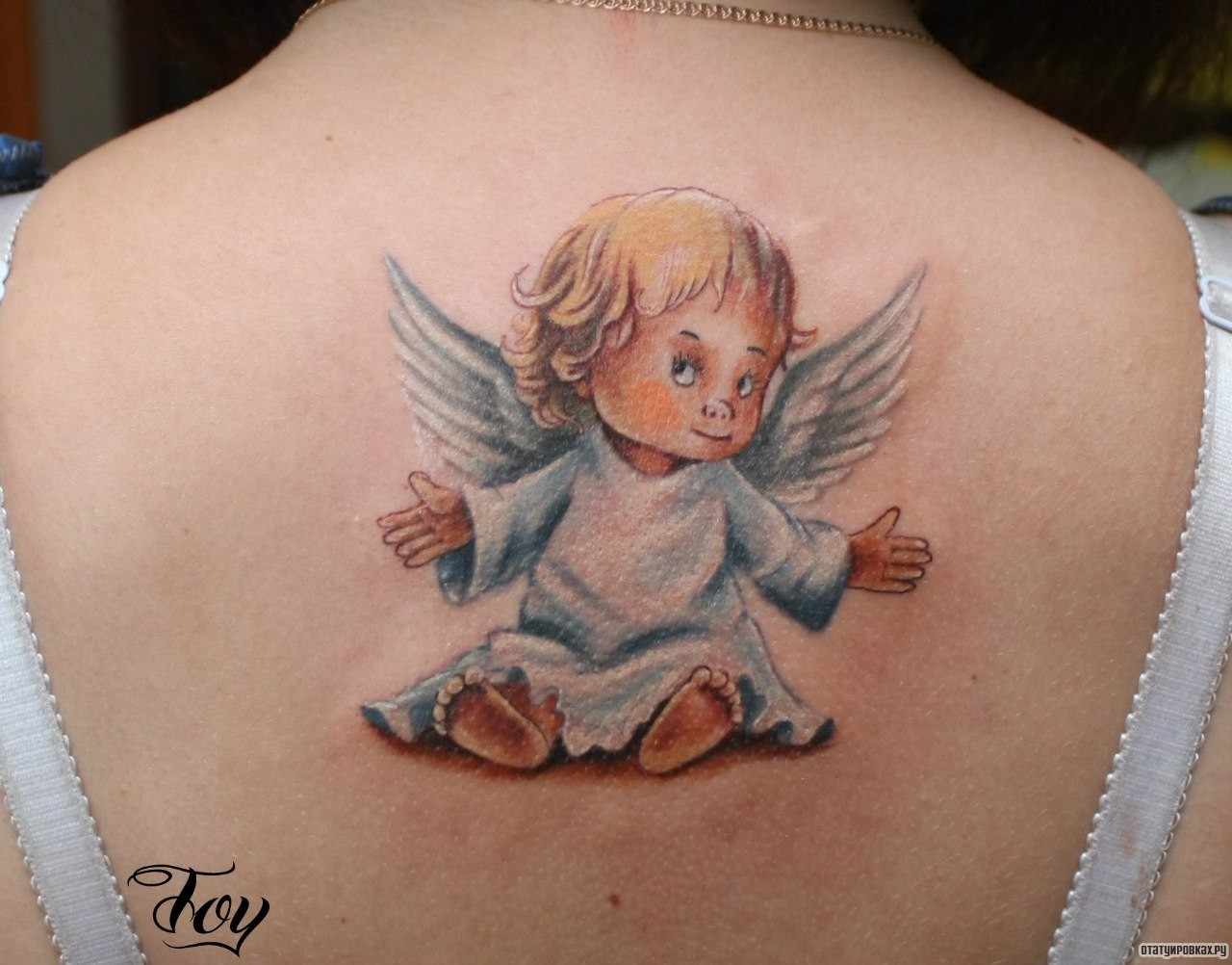 Фотография татуировки под названием «Ангел разведя руки»