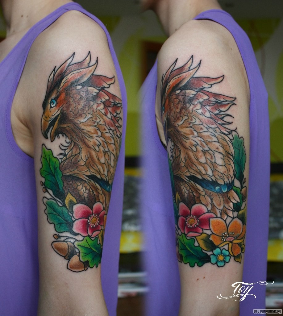 Фотография татуировки под названием «Коричневая птица и желуди»