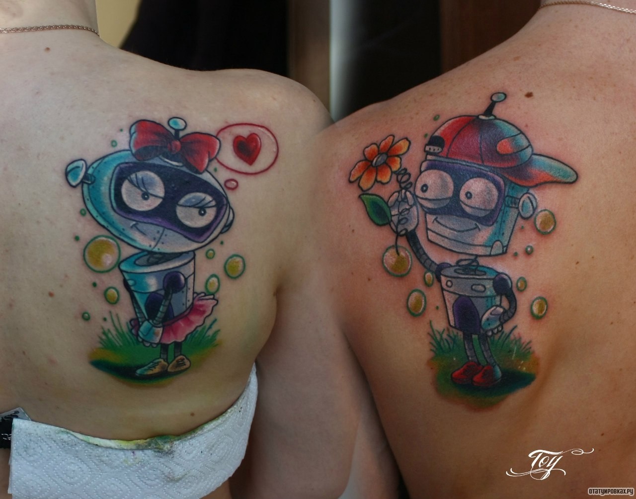 Фотография татуировки под названием «Два робота пара»