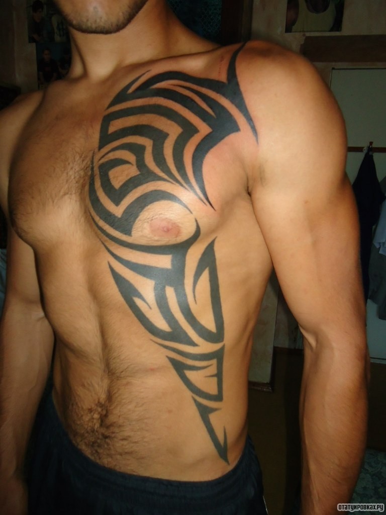 Фотография татуировки под названием «Трайбл узор на груди и животе»