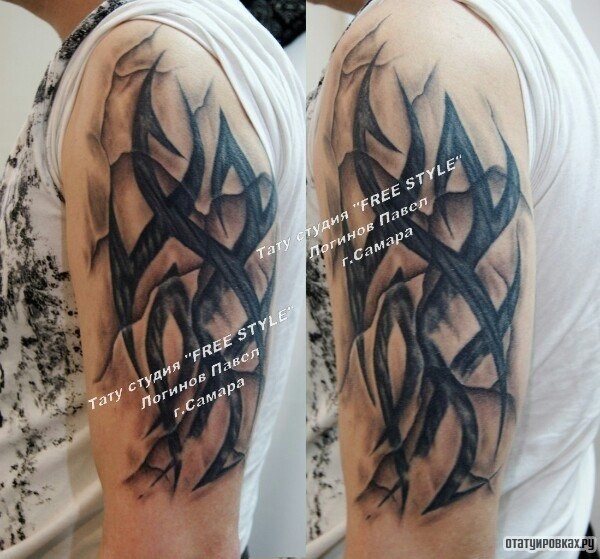 Фотография татуировки под названием «Трайбл узо на плече»