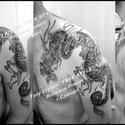 Тату японский дракон на плече и груди парня