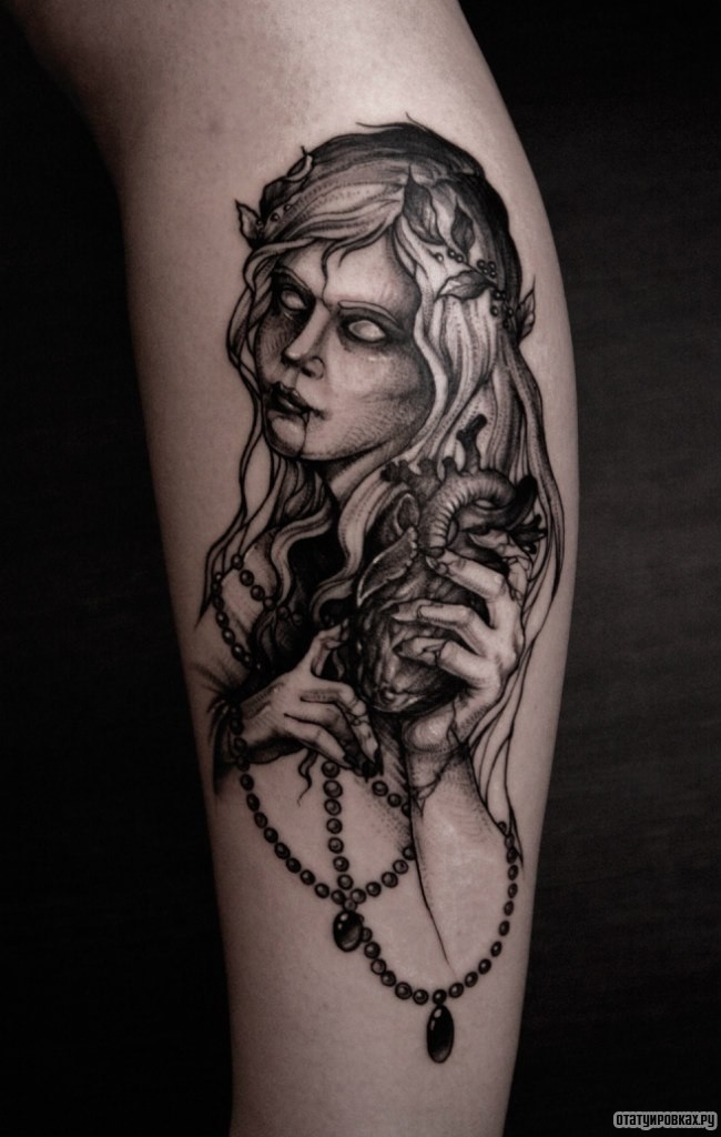 Фотография татуировки под названием «Девушка с сердцем в руках»