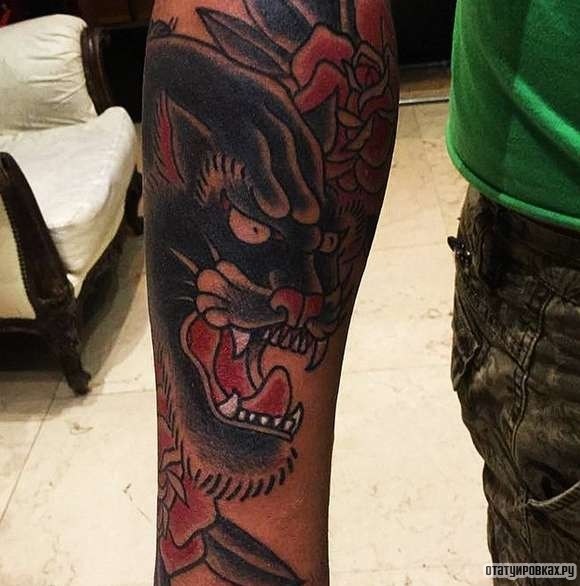 Фотография татуировки под названием «Пантера с оскалом»