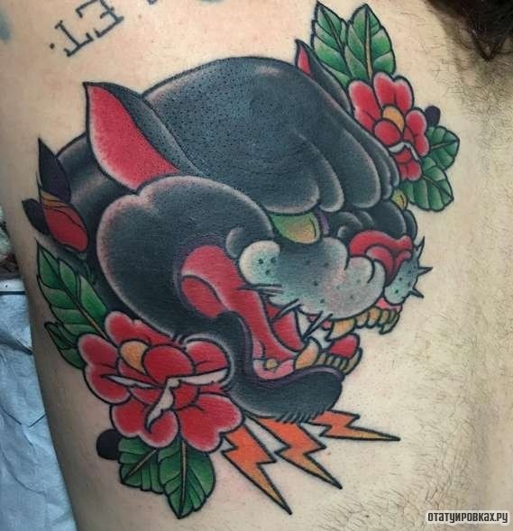 Фотография татуировки под названием «Оскал пантеры с цветами»
