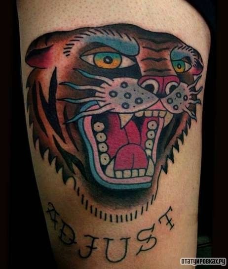 Фотография татуировки под названием «Тигр оскаливается»