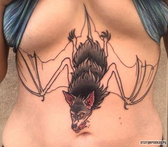 Фотография татуировки под названием «Летучая мышь в виде волка»