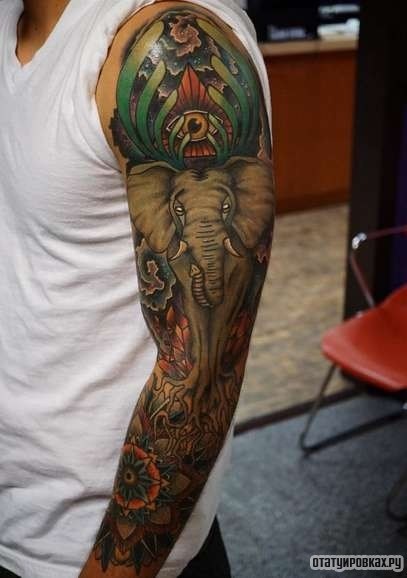Фотография татуировки под названием «Слон, всевидящее око и узоры»