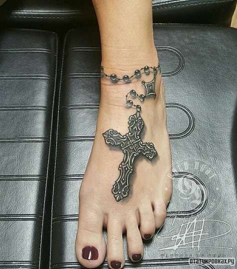 Фотография татуировки под названием «Цепочка с крестом»