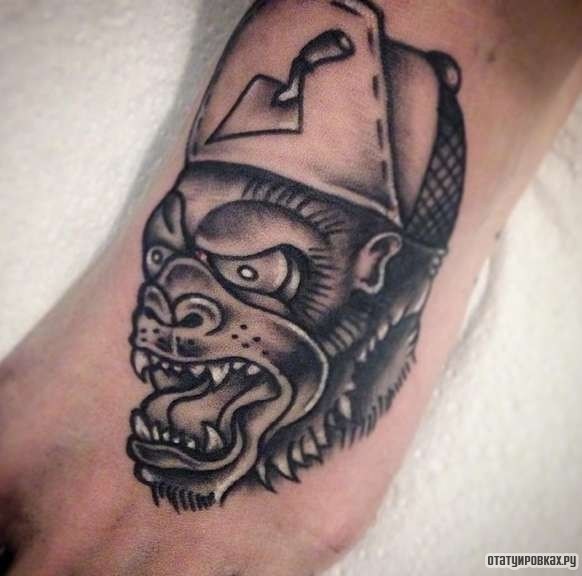 Фотография татуировки под названием «Демон в кепке»