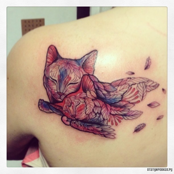 Фотография татуировки под названием «Два кота»