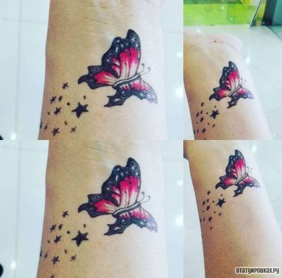 Фотография татуировки под названием «Красная бабочка со звездами»