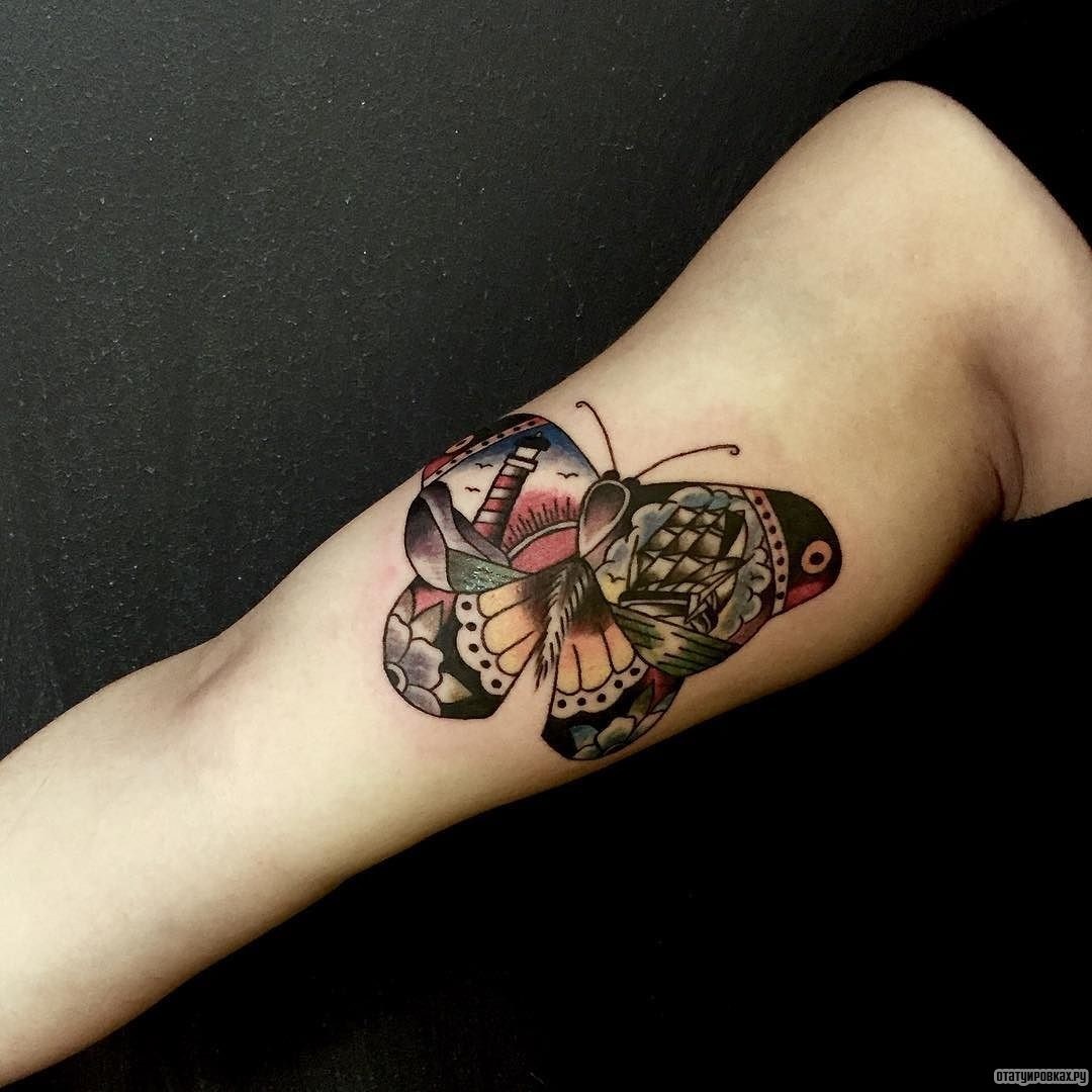 Фотография татуировки под названием «Бабочка с маяком в узоре»