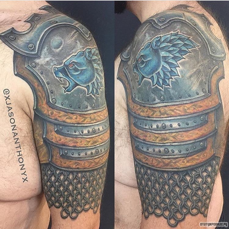 Фотография татуировки под названием «Латы с оскалом синего животного»