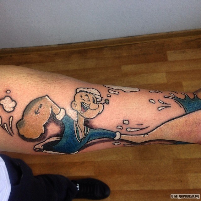 Фотография татуировки под названием «Герой мультфильма с большой рукой»