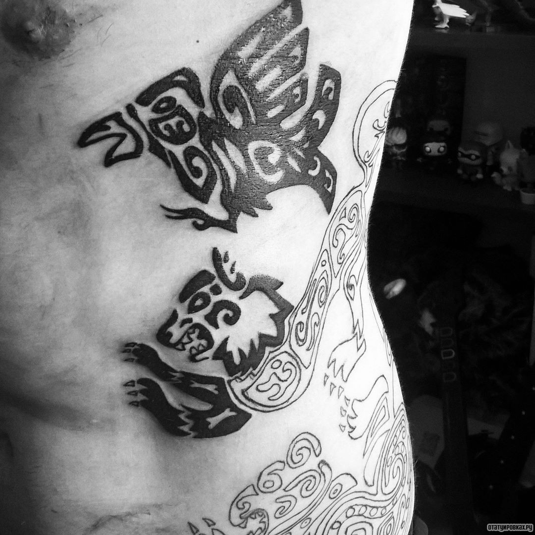 Фотография татуировки под названием «Скифский узор птица и лев»