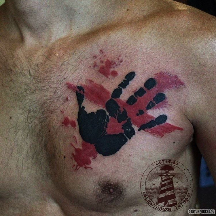 Фотография татуировки под названием «След руки человека»