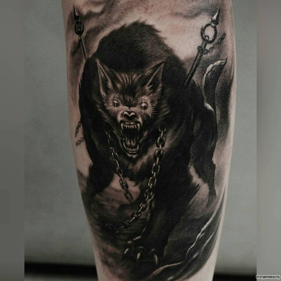 Фотография татуировки под названием «Дьявол в виде зубастого волка»