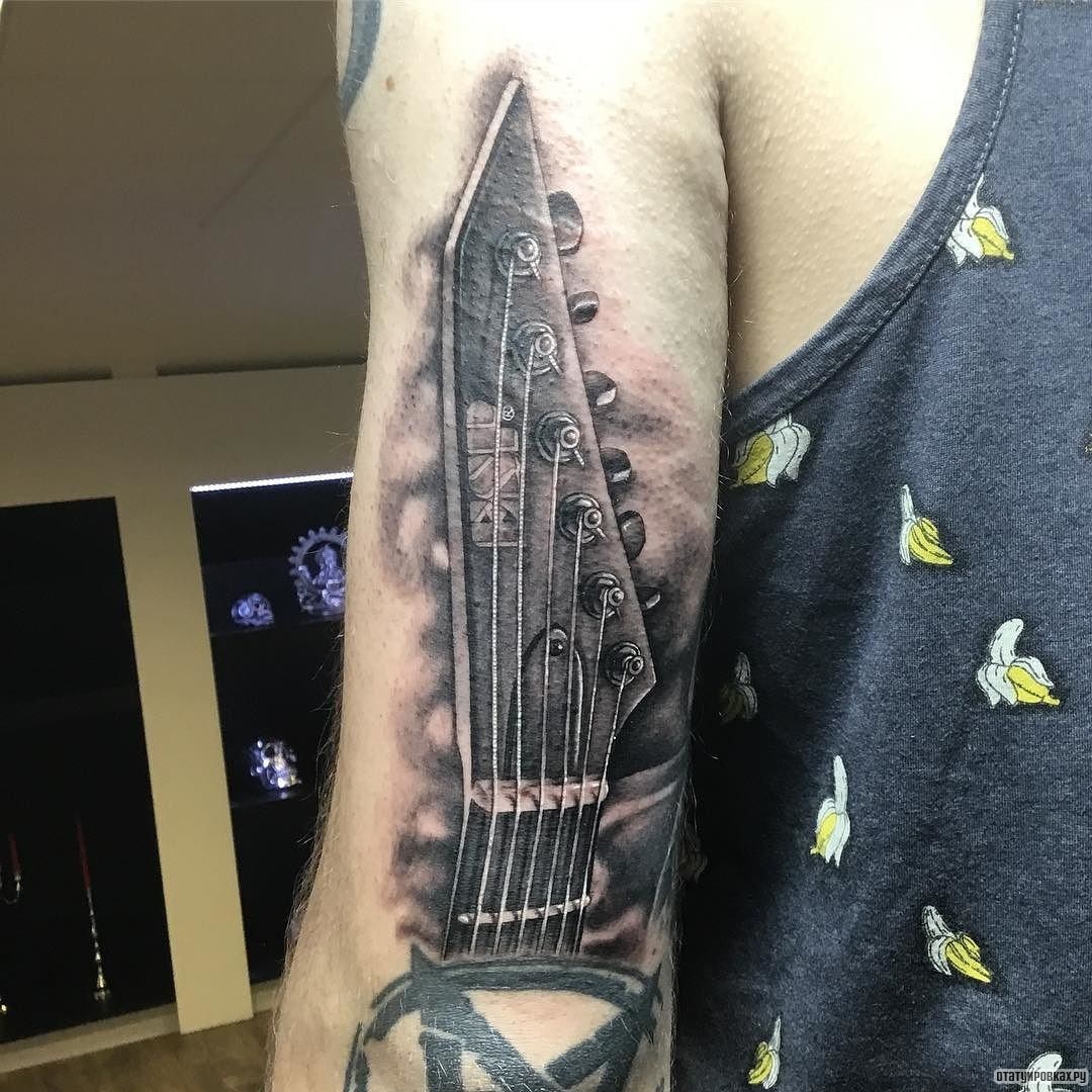 Фотография татуировки под названием «Струны гитары»