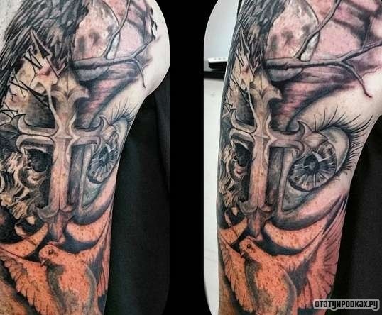 Фотография татуировки под названием «Глаз с крестом и веткой дерева»